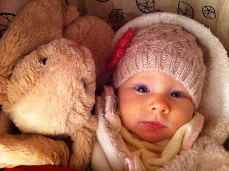 Snuggled in her stroller with her buddy, Lapierre Lapin.